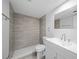 Bright bath with tiled walk-in shower at 4725 Cove Cir # 202, St Petersburg, FL 33708