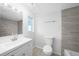 Bright bathroom with tile floors and modern vanity at 4725 Cove Cir # 202, St Petersburg, FL 33708