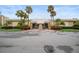 Clubhouse entrance showcasing meticulous landscaping and symmetrical design at 4725 Cove Cir # 202, St Petersburg, FL 33708