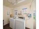 Laundry room with two machines and a sink at 4725 Cove Cir # 202, St Petersburg, FL 33708