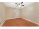 A spacious bedroom with a ceiling fan and wooden floors at 5246 81St N St # 6, St Petersburg, FL 33709