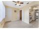 Dining area with fan, neutral walls and tile floor adjacent to kitchen at 5246 81St N St # 6, St Petersburg, FL 33709