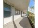 Exterior building walkway with trimmed bushes, stairs, and access to resident units at 5246 81St N St # 6, St Petersburg, FL 33709