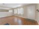 Living room featuring hardwood floors, bright walls, sheer curtains, and a neutral color palette at 5246 81St N St # 6, St Petersburg, FL 33709