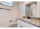 Bright bathroom showcasing granite counters and a large mirror above the vanity at 5885 114Th N Ter, Pinellas Park, FL 33782