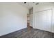 This bedroom features laminate wood flooring, a ceiling fan, and a double door closet at 5885 114Th N Ter, Pinellas Park, FL 33782