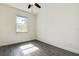 Well-lit bedroom with a modern ceiling fan and wood-look flooring, bathed in natural light at 5885 114Th N Ter, Pinellas Park, FL 33782