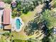 Aerial shot of a backyard with mature trees and a pool at 6010 17Th S Ave, Gulfport, FL 33707