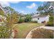 Well-maintained backyard featuring lush greenery and a brick-lined path at 6010 17Th S Ave, Gulfport, FL 33707