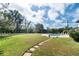 Spacious backyard with mature trees and a inviting in-ground pool at 6010 17Th S Ave, Gulfport, FL 33707