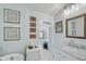 Elegant bathroom featuring a marble countertop, ornate mirror, and vintage-inspired decor at 6010 17Th S Ave, Gulfport, FL 33707