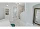 Bright bathroom with a large vanity, tiled floor, and walk-in shower at 6010 17Th S Ave, Gulfport, FL 33707