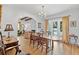 Light-filled dining room with hardwood floors and views of the backyard at 6010 17Th S Ave, Gulfport, FL 33707