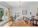 Elegant dining room with hardwood floors, chandelier, and a large window with natural light at 6010 17Th S Ave, Gulfport, FL 33707