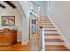 Inviting entryway showcasing hardwood floors, staircase, and a glimpse of the kitchen at 6010 17Th S Ave, Gulfport, FL 33707