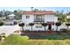 Charming two-story home with a red tile roof, covered balcony, manicured landscaping, and a well-maintained front yard at 6010 17Th S Ave, Gulfport, FL 33707