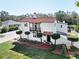 Charming home with a red tile roof and balcony offers mature landscaping and classic design at 6010 17Th S Ave, Gulfport, FL 33707