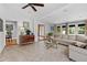 Inviting living room showcasing tile floors, a cozy sofa, and seamless transitions to other living spaces at 6010 17Th S Ave, Gulfport, FL 33707