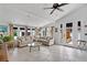 Bright living room featuring tile floors, a comfortable sectional sofa, and access to the outdoors at 6010 17Th S Ave, Gulfport, FL 33707