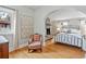 Comfortable main bedroom with hardwood floors and an archway that highlights the stone fireplace at 6010 17Th S Ave, Gulfport, FL 33707