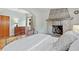 Inviting main bedroom featuring a stone fireplace, hardwood floors, and a cozy atmosphere at 6010 17Th S Ave, Gulfport, FL 33707