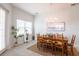 Bright dining room with wood table, chandelier, decorative accents, and modern decor at 7611 34Th W Ave # 303, Bradenton, FL 34209