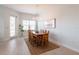 Dining room with a wooden table, chandelier, and natural light from a window at 7611 34Th W Ave # 303, Bradenton, FL 34209