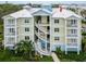 Exterior of a condo building with a view of the outdoor staircases at 7611 34Th W Ave # 303, Bradenton, FL 34209