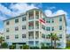 A multi-story condo building featuring private balconies, corner view, and abundant natural light at 7611 34Th W Ave # 303, Bradenton, FL 34209