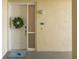 Inviting front door with a wreath, welcome mat and unit number 303 at 7611 34Th W Ave # 303, Bradenton, FL 34209