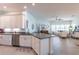 Bright, modern kitchen open to the living area, featuring stainless appliances and white cabinetry at 7611 34Th W Ave # 303, Bradenton, FL 34209