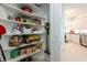 Well-organized walk-in pantry with ample shelving and storage space, adjacent to kitchen at 7611 34Th W Ave # 303, Bradenton, FL 34209