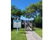 Private Resident Sunset Deck walkway with signage and lush landscaping at 7611 34Th W Ave # 303, Bradenton, FL 34209