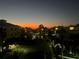 Sunset view of the condos, buildings, and pond at 7611 34Th W Ave # 303, Bradenton, FL 34209