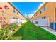 Backyard view with white fence, green grass, and blue sky above at 780 Spring Flowers Trl, Brandon, FL 33511