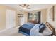 Bedroom featuring carpet, a ceiling fan, and two windows at 780 Spring Flowers Trl, Brandon, FL 33511