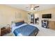 Bedroom with ceiling fan, carpet, and a view of an ensuite bathroom at 780 Spring Flowers Trl, Brandon, FL 33511