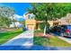 Two-story home with a two car garage, driveway, and a lush green front yard at 780 Spring Flowers Trl, Brandon, FL 33511