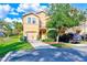 Two-story home with a two car garage, driveway, and a lush green front yard at 780 Spring Flowers Trl, Brandon, FL 33511
