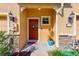 Charming front door with stone veneer and a well-manicured yard at 780 Spring Flowers Trl, Brandon, FL 33511
