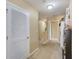 Hallway with carpet, a closet, and a view of stairs leading to another level at 780 Spring Flowers Trl, Brandon, FL 33511