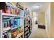 Hallway with lots of books and a view into additional rooms at 780 Spring Flowers Trl, Brandon, FL 33511