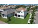 An aerial view of a house featuring a manicured lawn, sidewalk and neighborhood at 923 Seagrape Dr, Ruskin, FL 33570