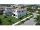 An aerial view of a house with landscaping, sidewalks and surrounding neighborhood at 923 Seagrape Dr, Ruskin, FL 33570