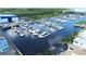 Wide aerial view of a boat marina with large boats on docks and boat storage at 923 Seagrape Dr, Ruskin, FL 33570