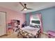 bedroom featuring whimsical decor, pastel walls, and a cozy atmosphere at 9693 58Th N St, Pinellas Park, FL 33782