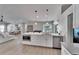 Open kitchen design featuring stainless appliances, white cabinetry, and quartz countertops at 9693 58Th N St, Pinellas Park, FL 33782