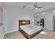 Bright main bedroom featuring a ceiling fan and outdoor access at 9693 58Th N St, Pinellas Park, FL 33782