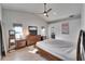 Main bedroom with a ceiling fan and vaulted ceiling at 9693 58Th N St, Pinellas Park, FL 33782