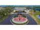 Aerial view of the Sun City Center Community Hall featuring manicured landscaping and the Sun City Center Veterans Memorial at 1004 Regal Manor Way, Sun City Center, FL 33573